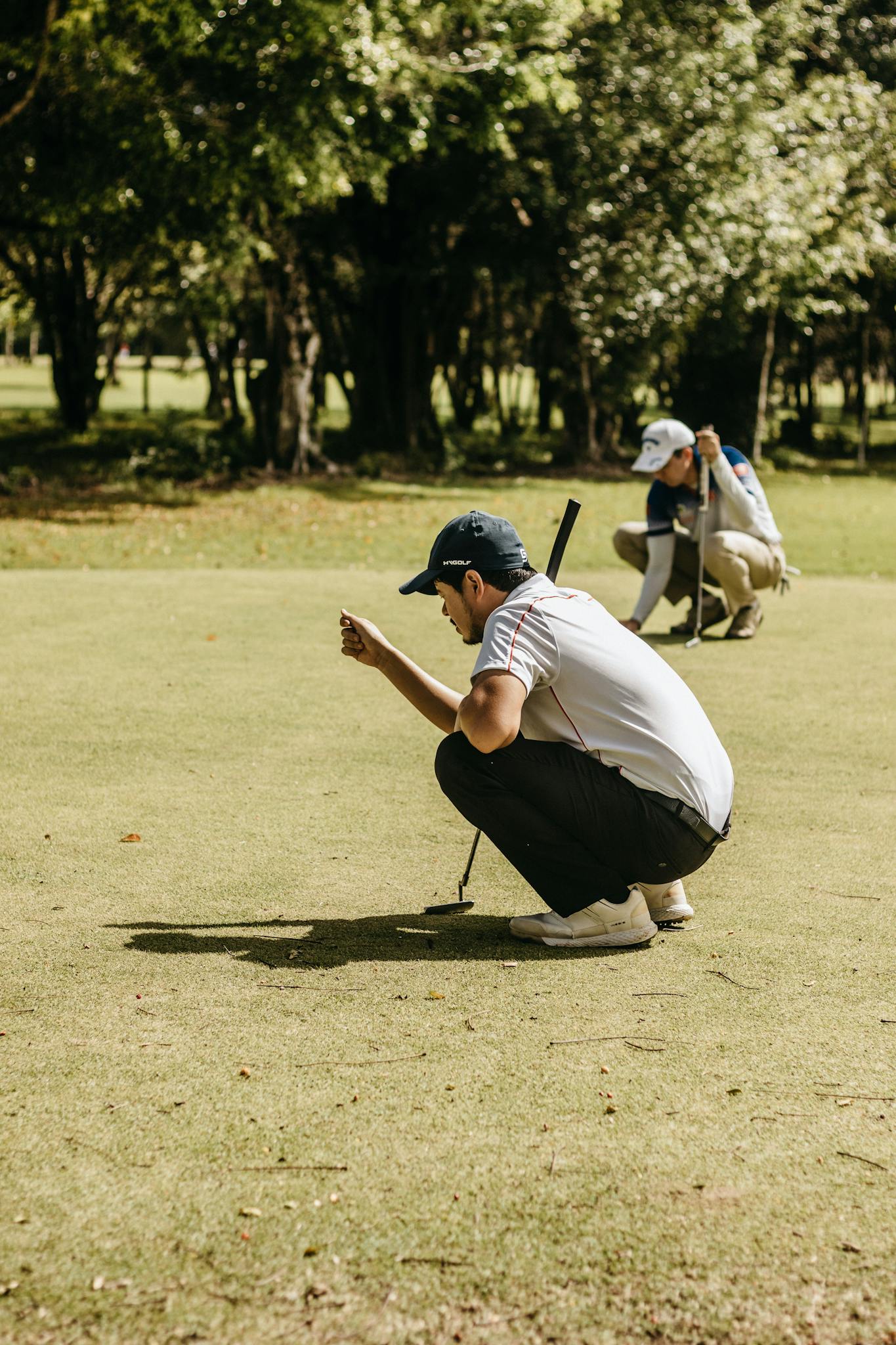 Man Lining Up of Golf Course